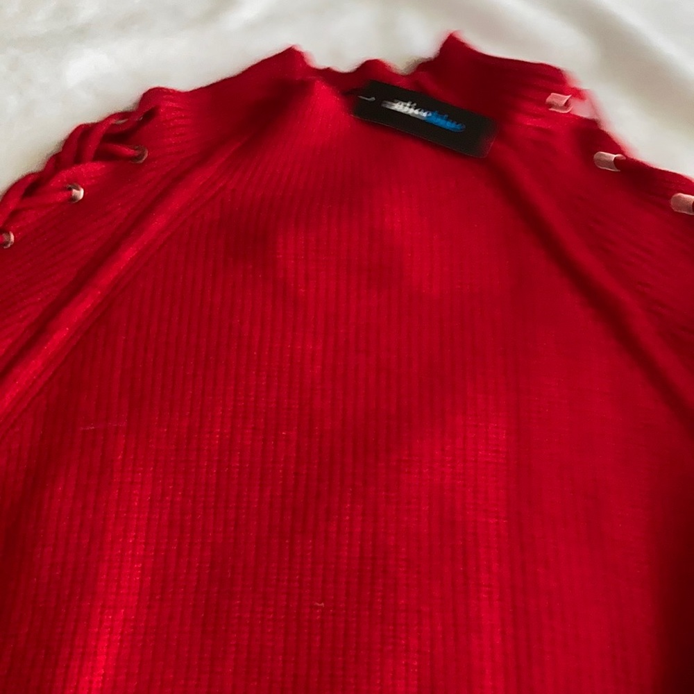 Women’s sweater with lace up sleeves